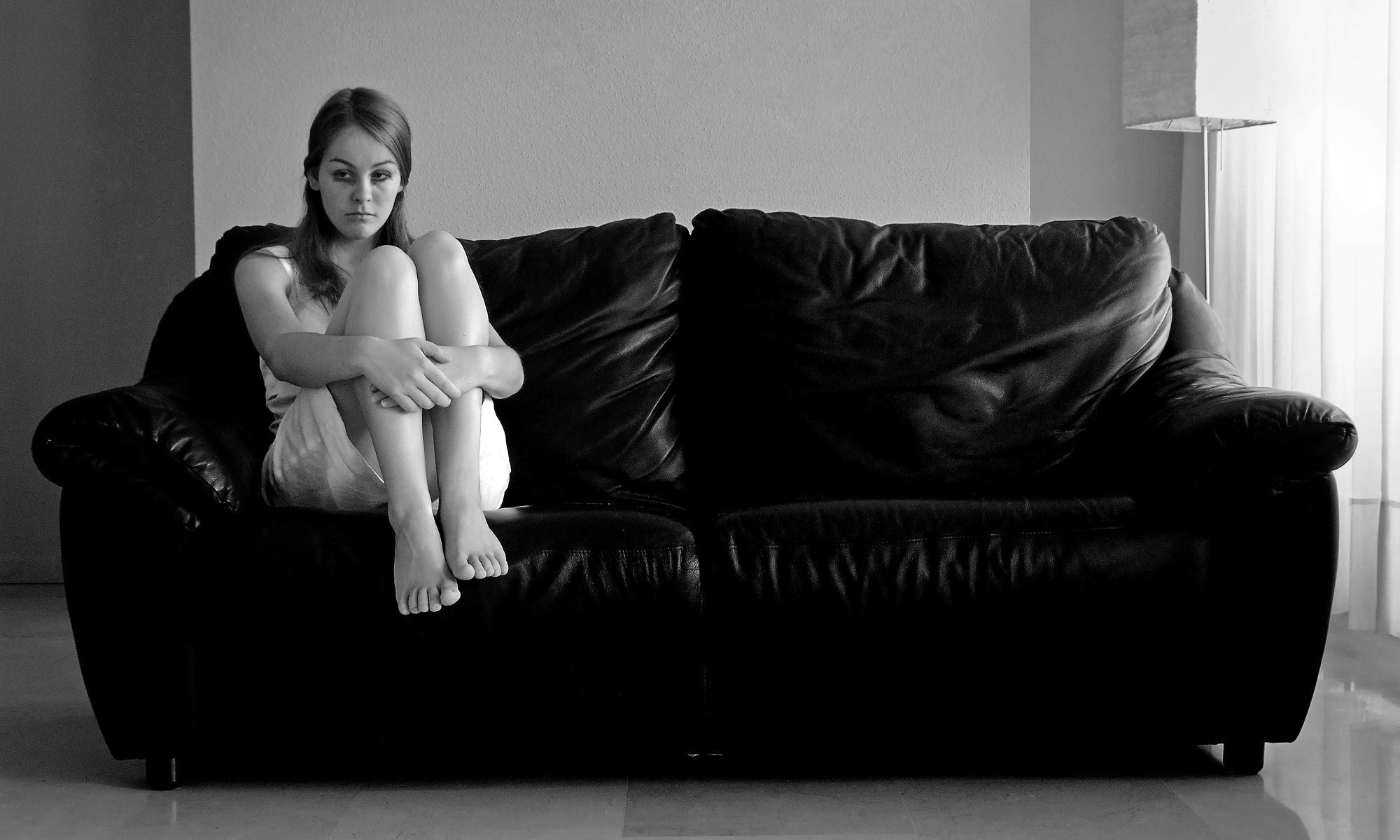 image of female on sofa